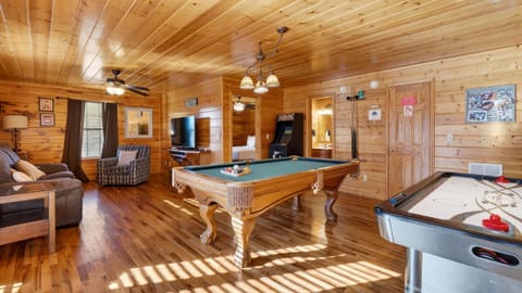 Competitive fun awaits with the air hockey table and full-sized pool table.