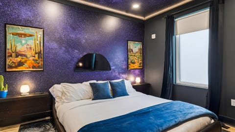 The primary bedroom features a King bed, TV and an ensuite bathroom.