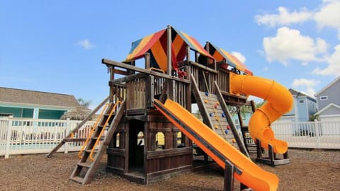 Large children’s playground structure with slides located within the complex.