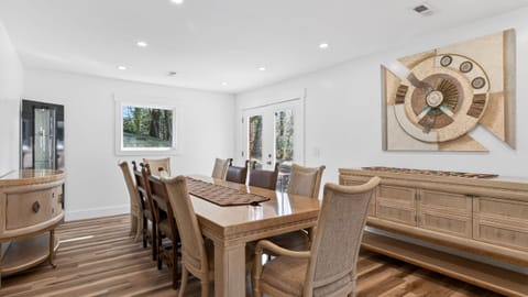 Gather for memorable meals at the spacious dining table—easy access to the patio for indoor-outdoor flow.