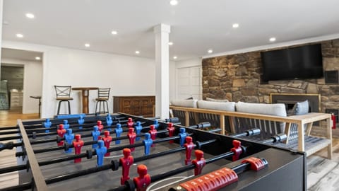 Foosball showdowns in the downstairs game room—plus a stone fireplace lounge and big-screen TV for post-game relaxing.