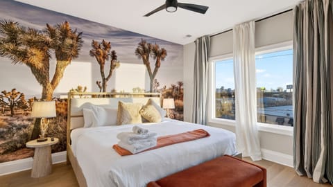 Bedroom 2 (Joshua Tree NP Themed) features a king bed, TV and an ensuite bathroom.