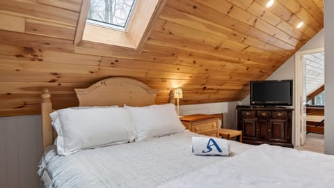 Loft room with queen-sized bed.