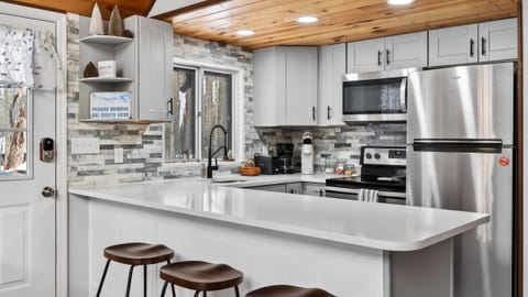 Modern kitchen with a spacious breakfast bar.