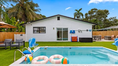 Private pool with playful extras and plenty of turf space for lounging, games, and sunny Florida days.
