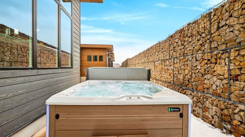 Private outdoor hot tub—your go-to spot for a post-ski soak with crisp mountain air all around.