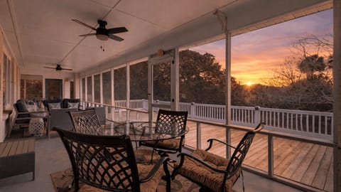 Relax on the breezy screened porch—sip your coffee, dine al fresco, and enjoy peaceful views in every direction.
