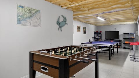 Game on downstairs—your private game room with foosball, ping-pong, and a big-screen setup for nonstop fun.
