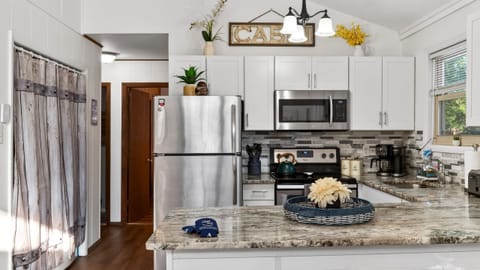 Designer kitchen featuring premium granite and stainless steel finishes.