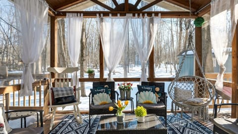 Screened porch – the perfect spot for morning coffee in the woods.