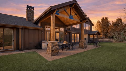 Golden-hour magic at the lodge—gather under the covered patio, fire up the grill, and unwind beneath a sunset sky.