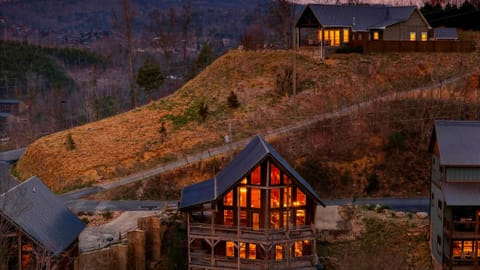 Spacious mountain cabin with glowing sunset views and room to gather across multiple levels.