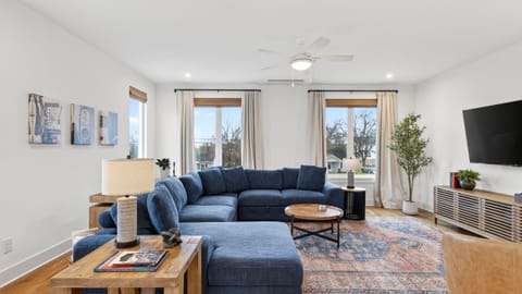 The spacious living room offers plenty of seating, natural light, and a comfortable place to gather after a day in Nashville.