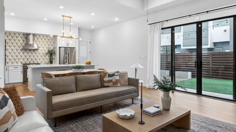 Bright, open-concept living with designer finishes—perfect for relaxing, gathering, and sharing meals in the sleek kitchen and dining space.