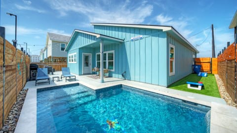 Your private pool is perfect for sunny Port Aransas days, with lounge seating and space to unwind right outside the house.