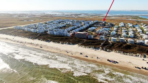 Get a bird’s-eye view of the neighborhood, with an arrow highlighting the perfect spot where your getaway awaits. (Dune & Done)