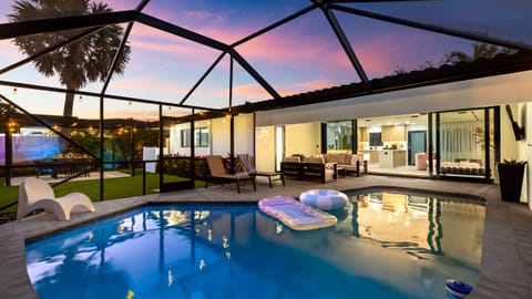 Private screened pool with seamless indoor-outdoor living.
