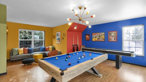 Game on in the ultimate hangout—pool table, shuffleboard, and arcade fun all in one vibrant game room.