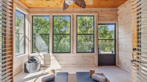 Peaceful sunroom perfect for yoga, stretching, or quiet relaxation.