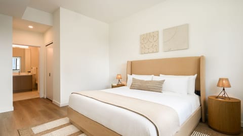 Unit 401: Bedroom 1 features a king bed with an ensuite bathroom.