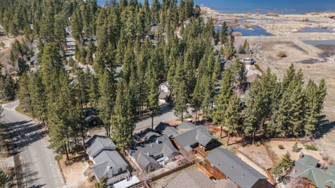 Aerial view of the home nestled among towering pines just moments from the shores of Big Bear Lake.