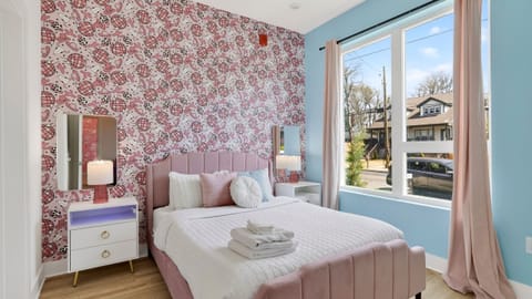 Bedroom 2 features a queen bed and an ensuite bathroom.