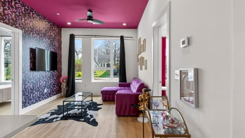 A vibrant living area with bold design, luxe seating, and a playful Nashville vibe.