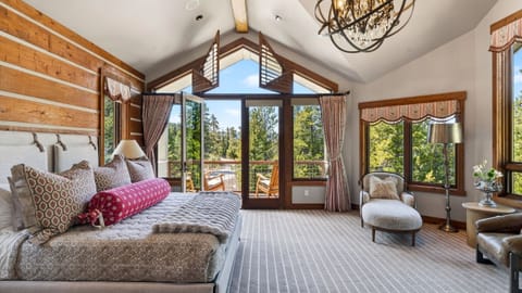 A chef’s kitchen with custom cabinetry, premium appliances, and a large island for easy gathering.