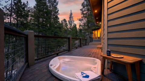 The primary bedroom features a king bed, TV, fireplace, balcony access and an ensuite bathroom.