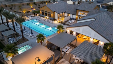 An aerial view of the expansive pool deck, cabanas, and social lounges.
