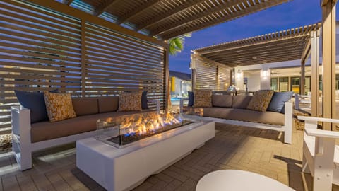 Cozy up by the outdoor fire pit and enjoy the stunning desert sunset.