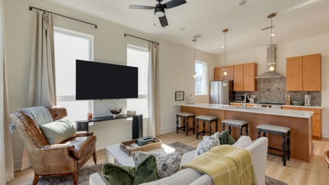 The living room features a large window and a chic modern design. (Hearth &amp; Hideout)