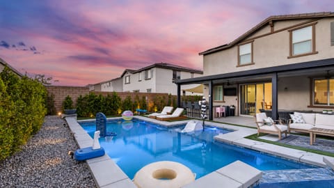 Welcome to your ultimate backyard entertainment paradise, complete with a sparkling custom pool, integrated spa, and extensive covered patio.
