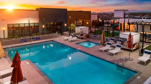 Unwind at the resort-style community pool and spa as the sunset lights up the evening sky.