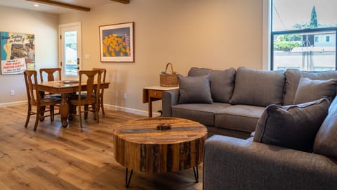 Gather at the table beside the relaxed seating