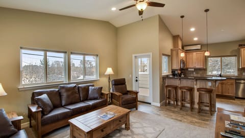 Gather around leather seating and a rustic coffee table