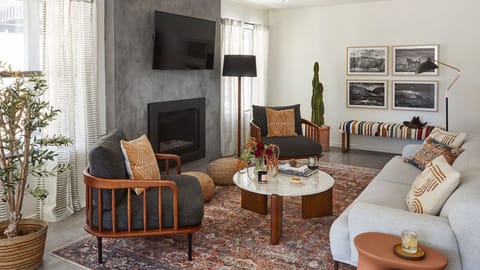 Gather around the fireplace in this relaxed living space