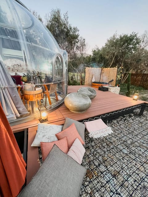 Property building, Patio, BBQ facilities, Hot Tub, Seating area