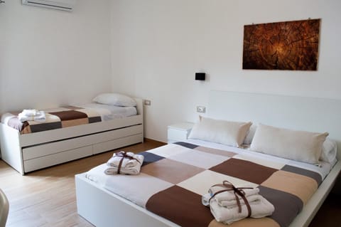 Bed, Photo of the whole room, Bedroom, towels, air conditioner