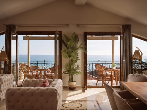 Natural landscape, Living room, Seating area, Dining area, Sea view