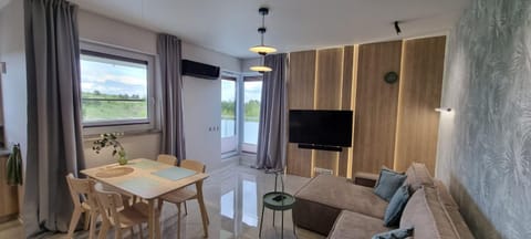 62m2 Apartament PREMIUM Łąki i Pola, ELEKTRYCZNE ROLETY, KLIMATYZACJA, GARAŻ, ŁADOWARKA AUT ELEKTRYCZNYCH Apartment in Lithuania