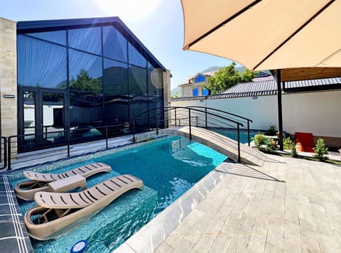 Property building, Patio, Day, Natural landscape, Hot Tub, View (from property/room), Balcony/Terrace, Pool view, Swimming pool, sunbed