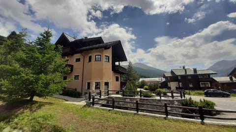 Property building, Spring, Day, Neighbourhood, Natural landscape, Mountain view