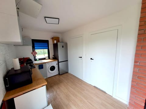 Dining area, minibar, washing machine, kitchen