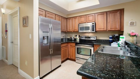 Kitchen or kitchenette, dishwasher, oven, stove, toaster