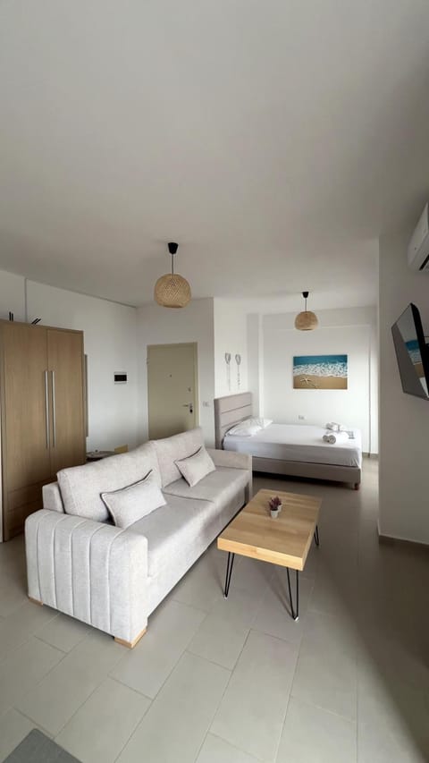 Bed, TV and multimedia, Seating area, wardrobe