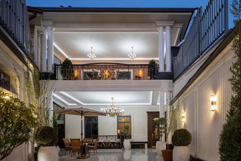 Property building, Patio, Night, Living room, Seating area
