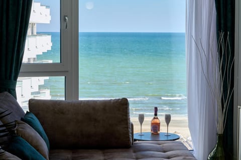 Day, View (from property/room), Living room, Seating area, Beach, Sea view