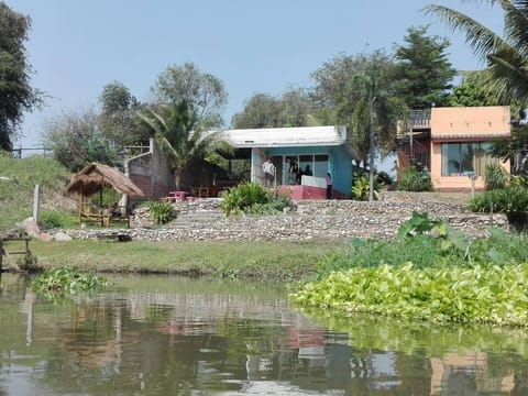 Facade/entrance, River view, group of guests