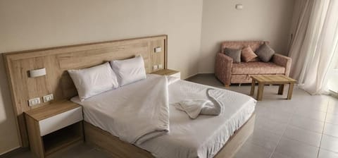 Bed, Seating area, Bedroom, towels